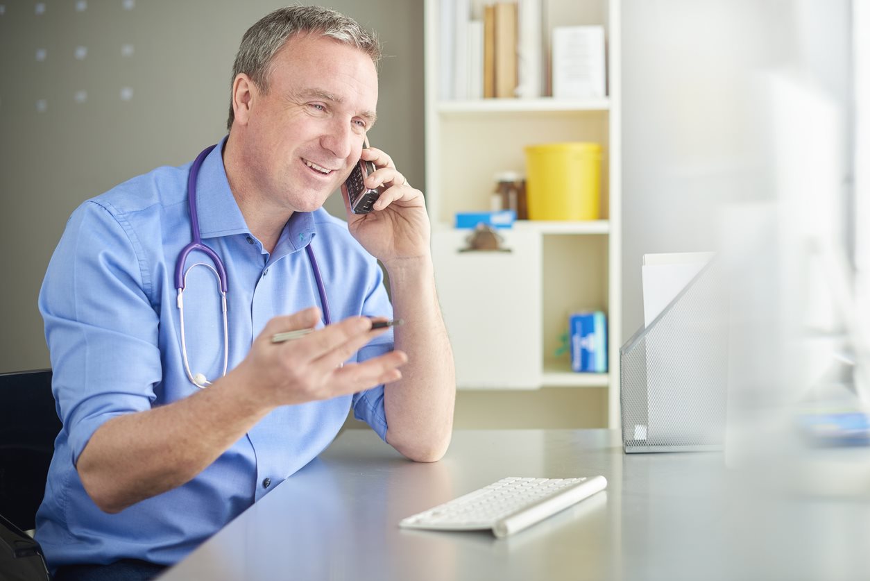 doctor on phone talking to patient