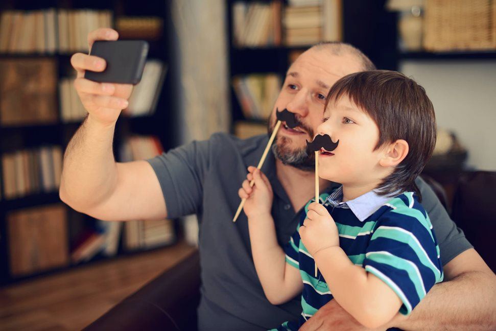 Father and son taking a selfie