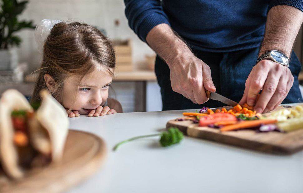 Dad and daughter cooking in the kitchen