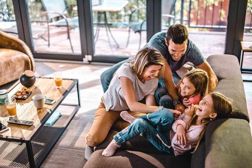 Family playing together on the couch