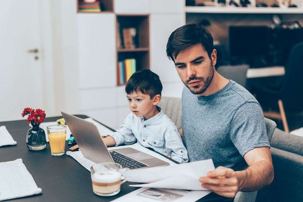 Father and son working at home
