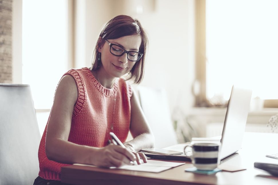 Woman working on laptop from home