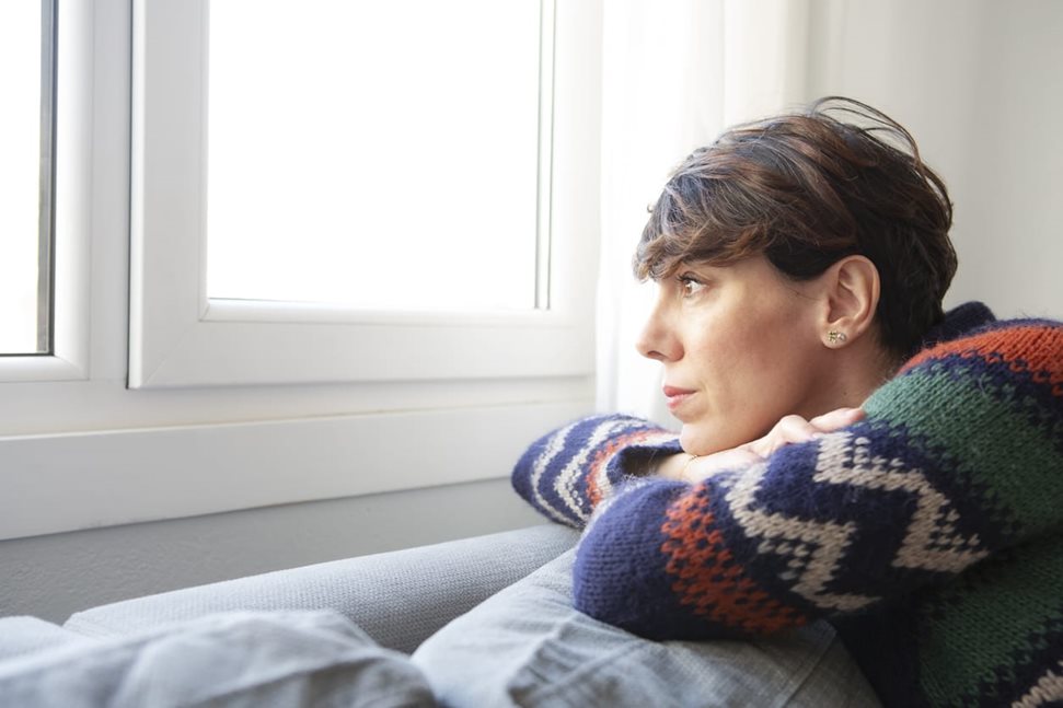 Woman looking out the window