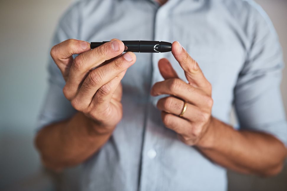 Man checking his insulin