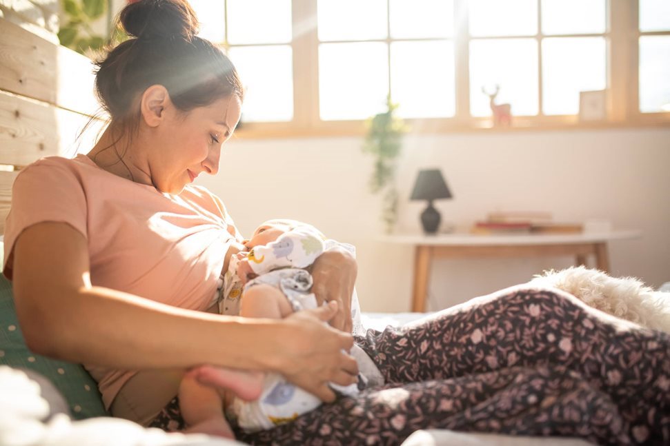 Mother breastfeeding her new born baby