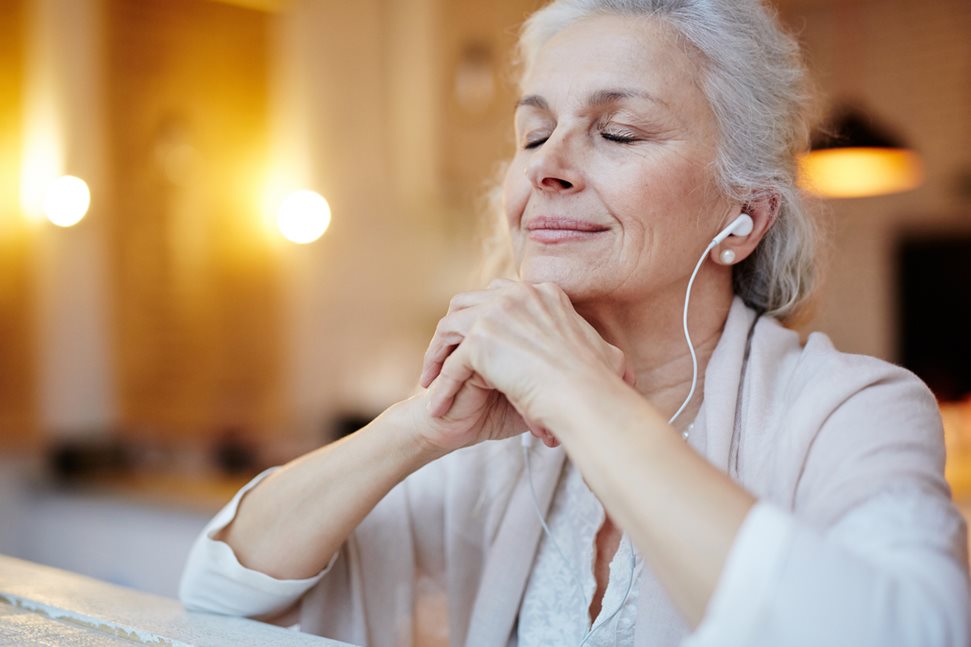 Older woman listening to music