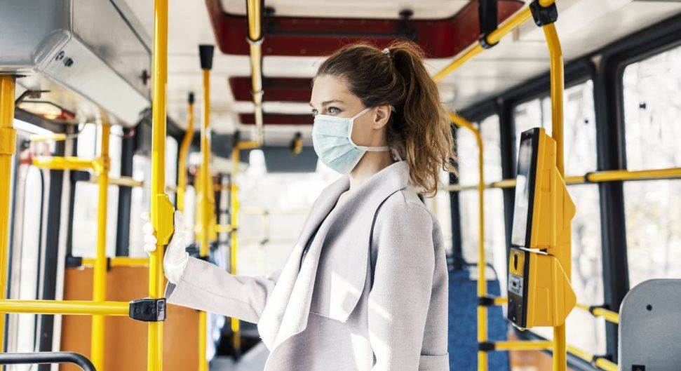 Woman on bus with face mask