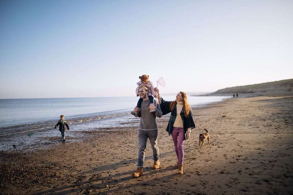 Family playing at the beach