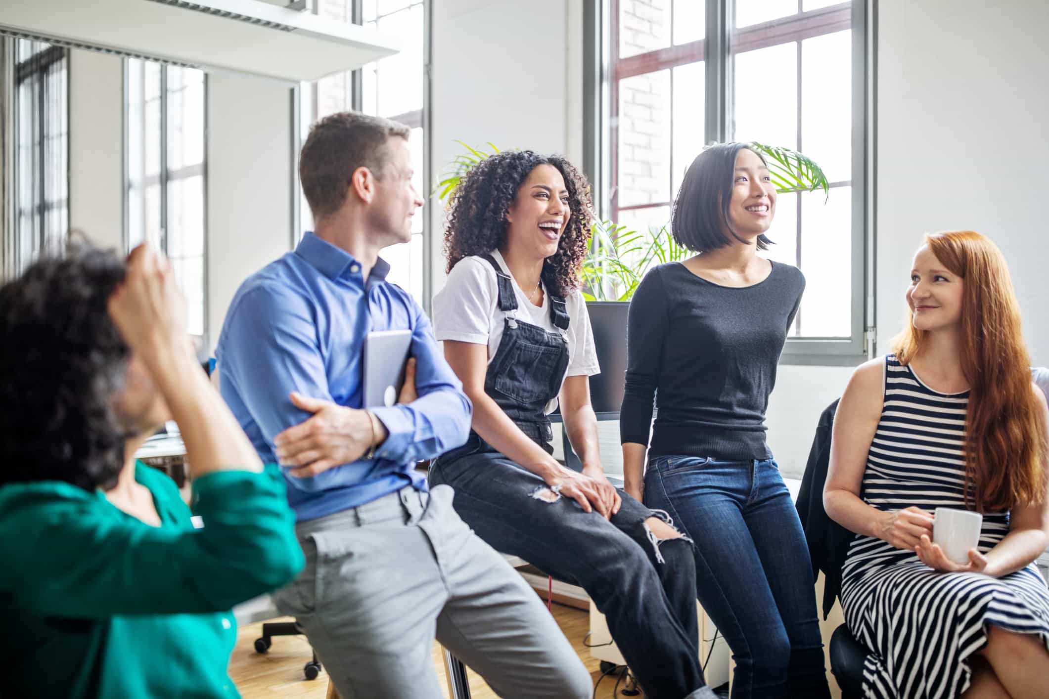 Group of colleagues having a discussion in work