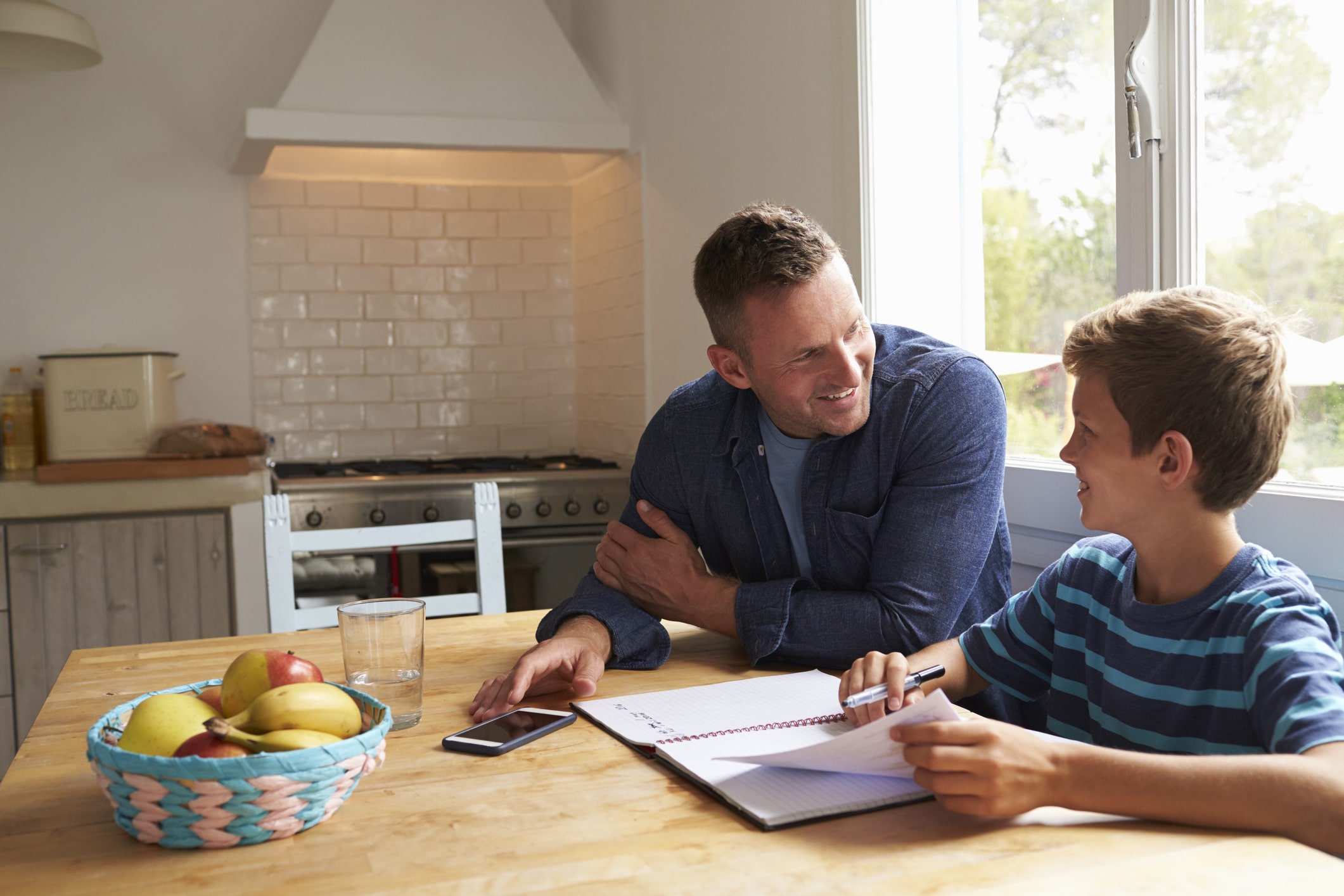 Dad helping son with homework