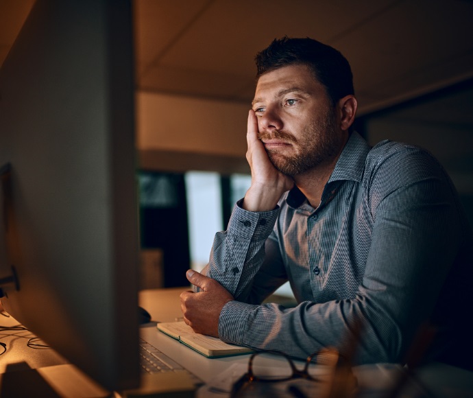 man working late in office
