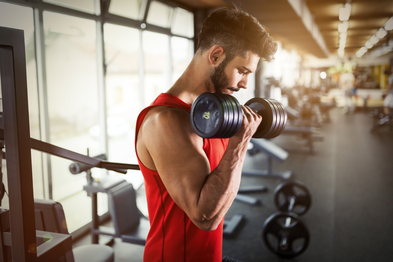 man lifting weights