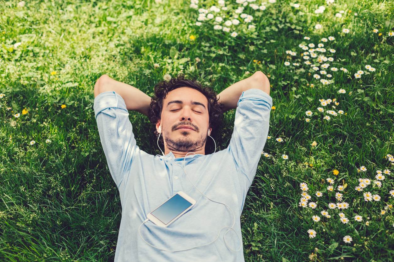 man lying in grass