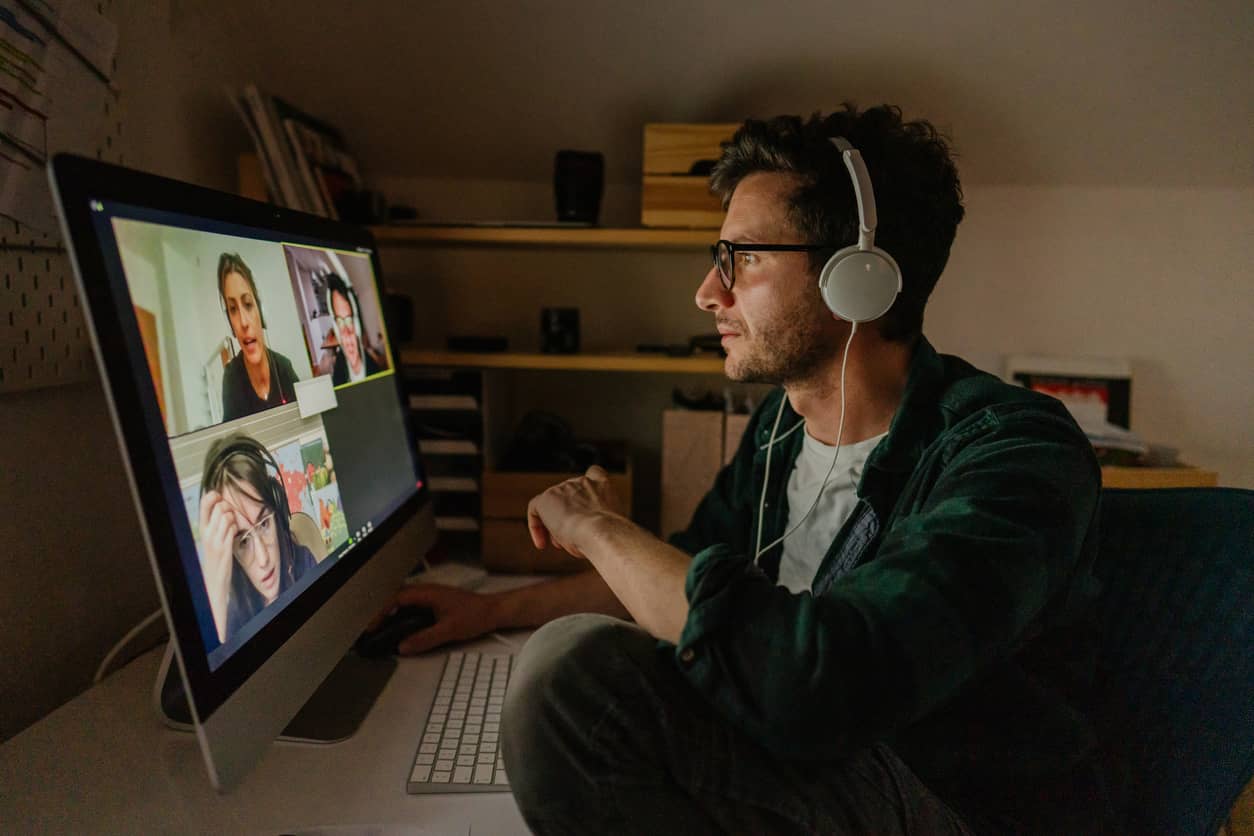 Man on zoom call with colleagues