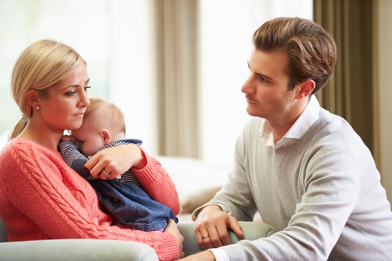 stressed parents with baby