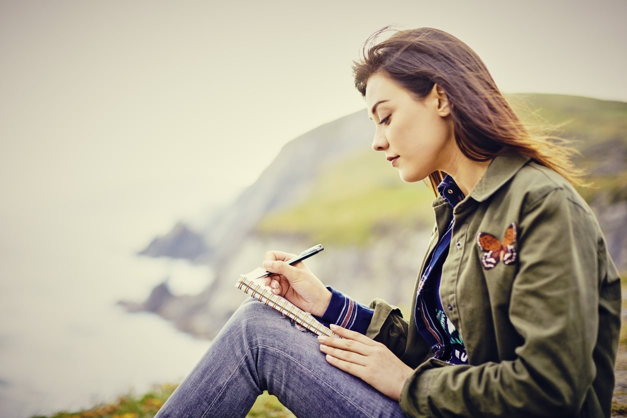 woman writing journal