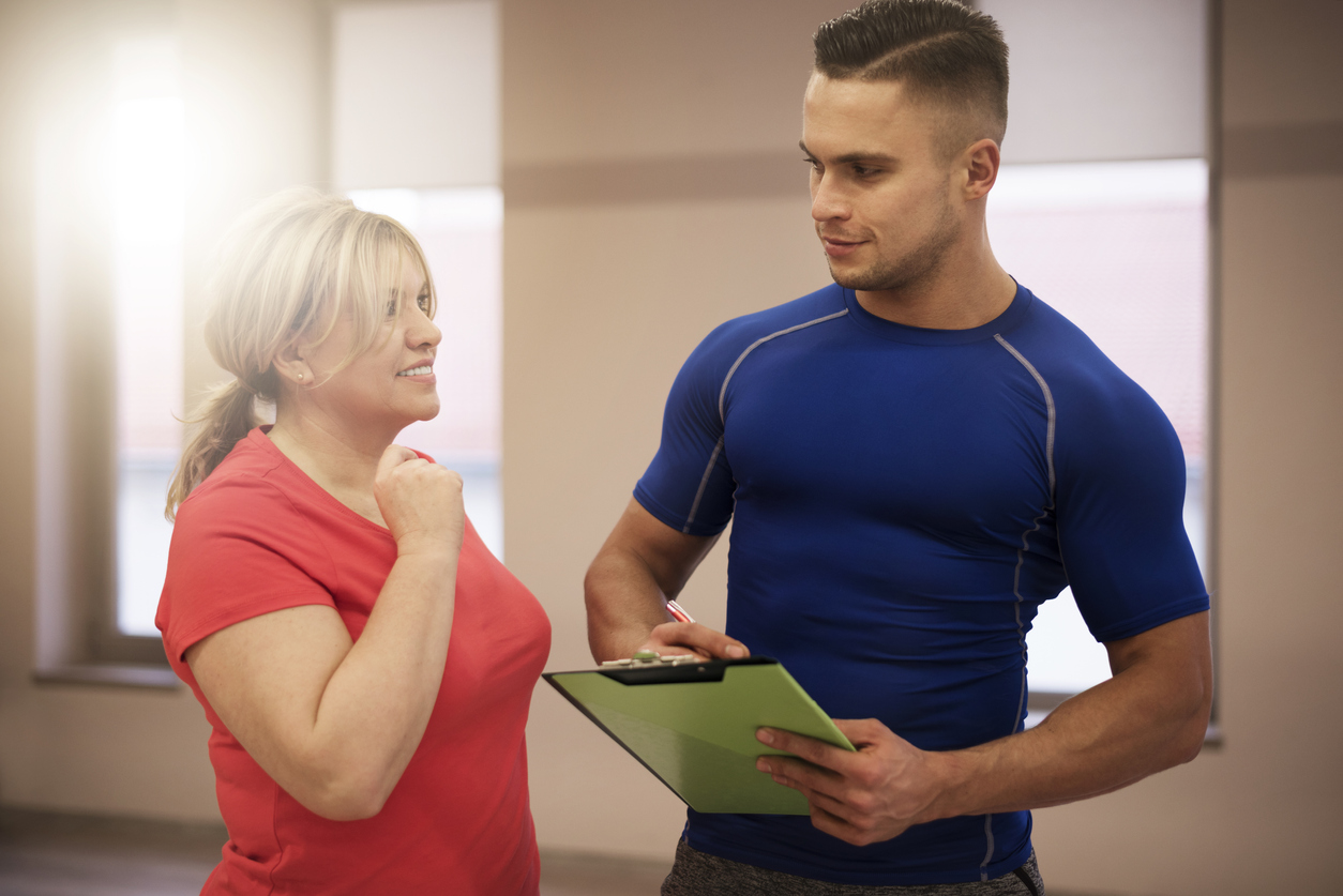 woman and man with clipboard