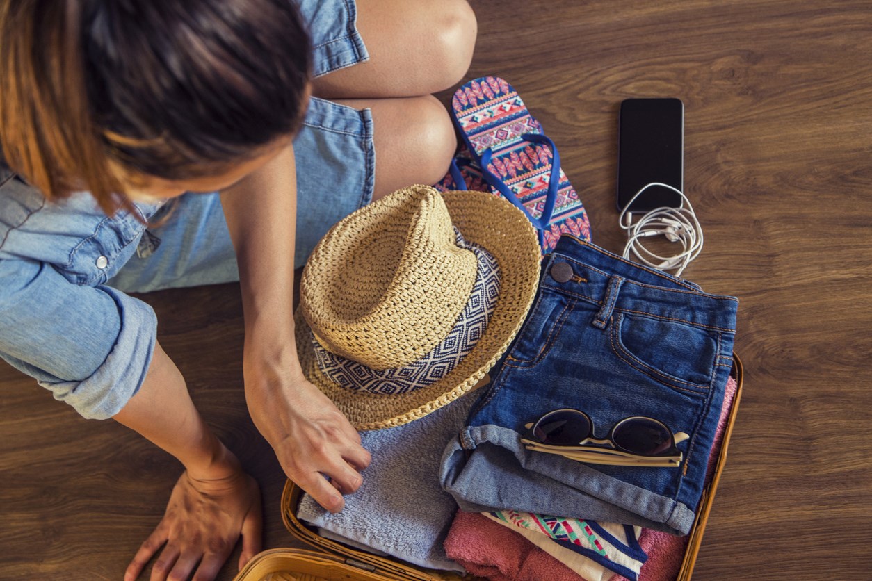 woman packing suitcase