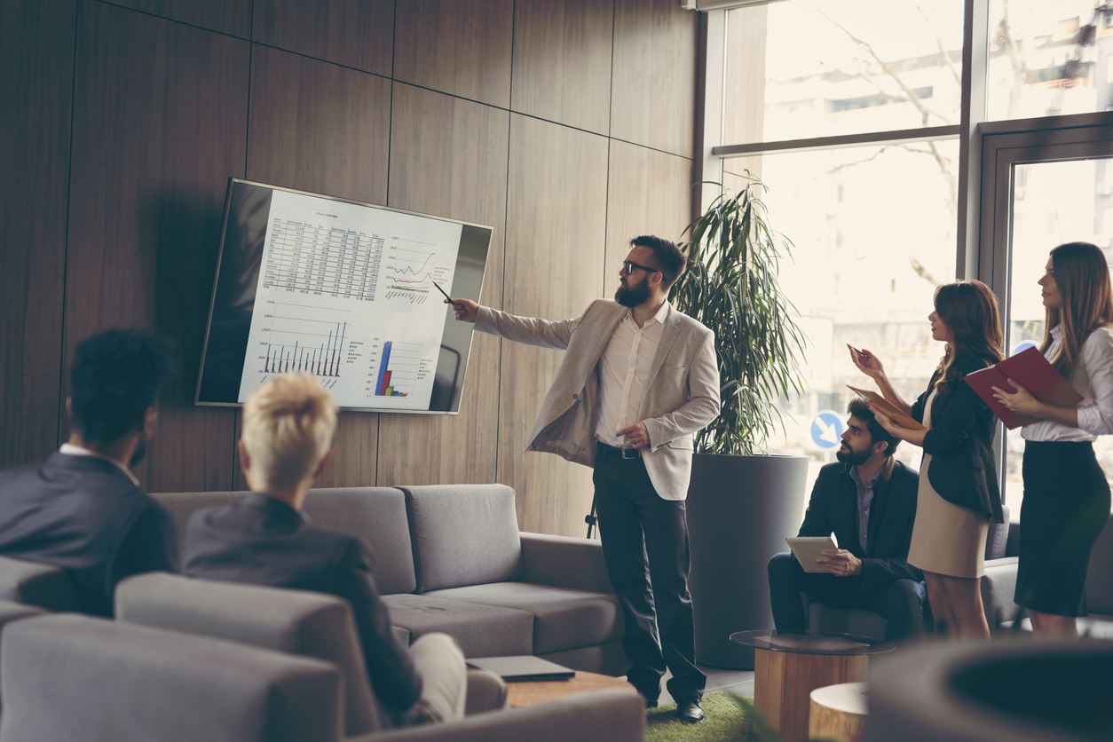 man giving presentation in office