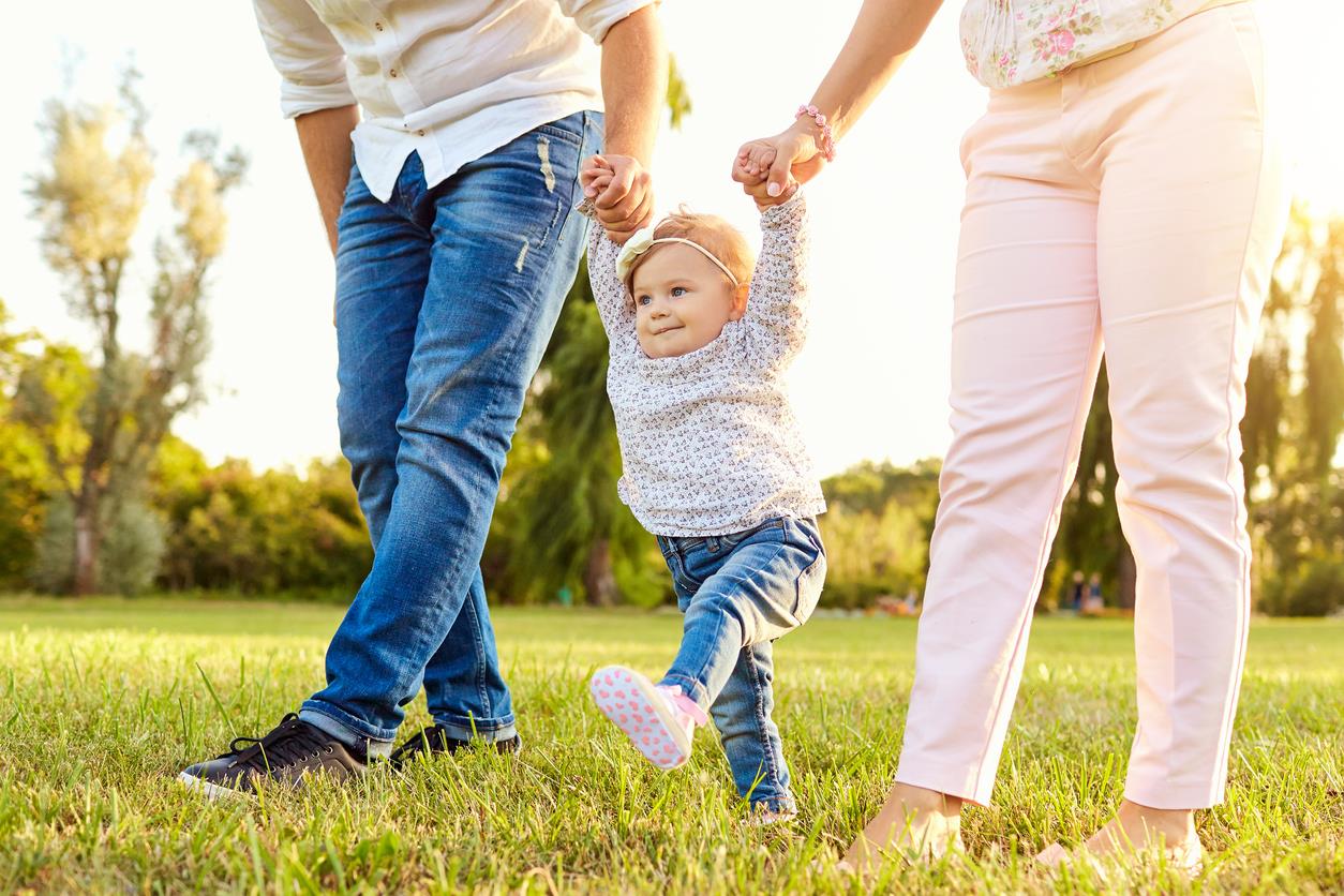 parents and toddler in park