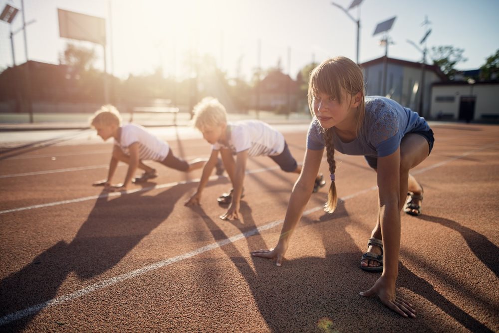 children about to sprint on running track