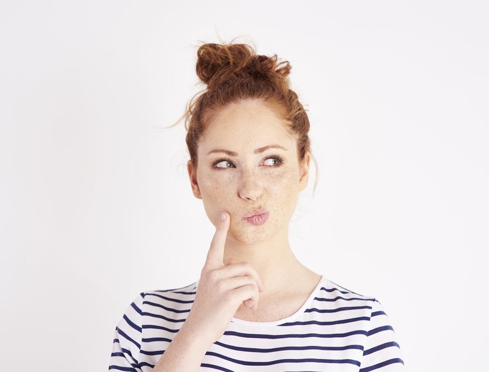 Woman thinking about alcohol consumption
