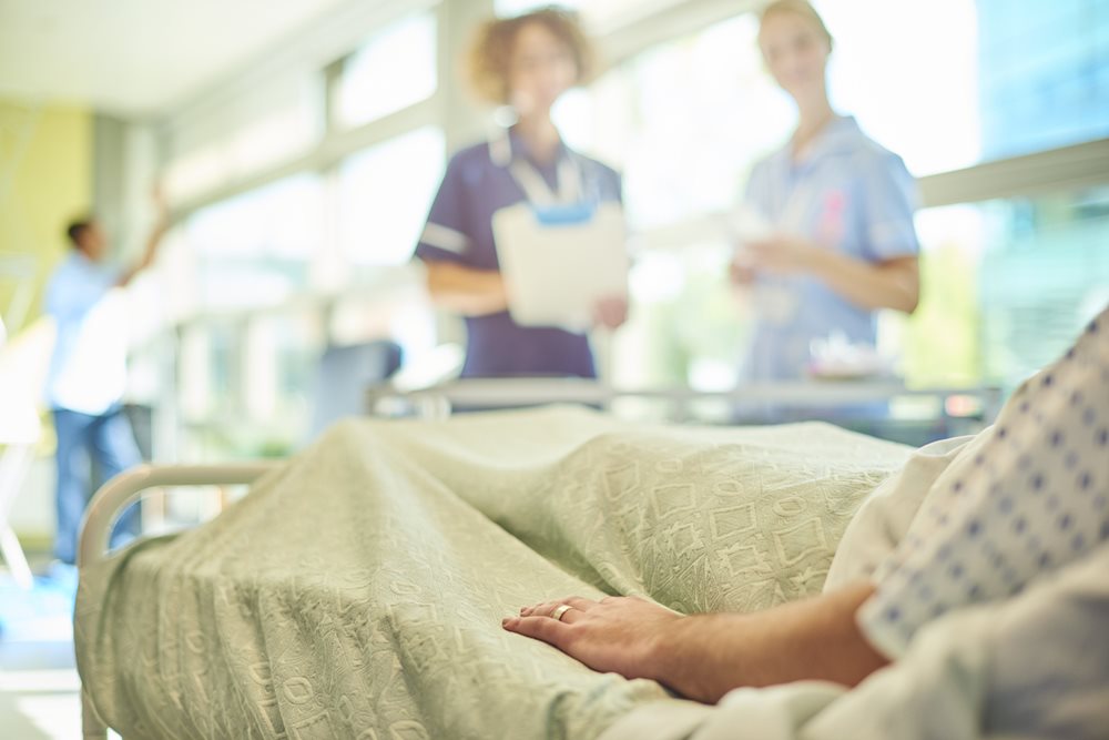 Cancer patient in hospital bed