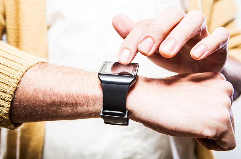 Man with wearable fitness tracker on his wrist