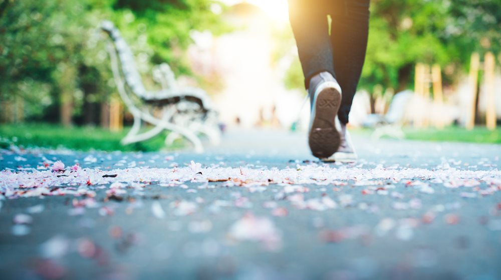 man jogging on path in park